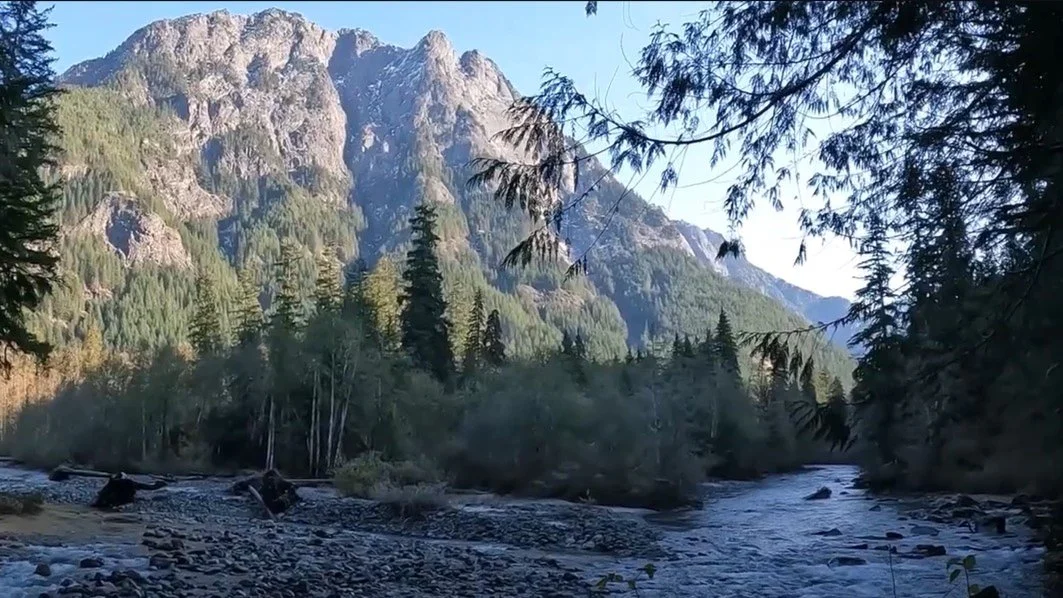 The serene landscape of the Middle Fork Snoqualmie Trail, inviting hikers to immerse themselves in nature along the riverside path.